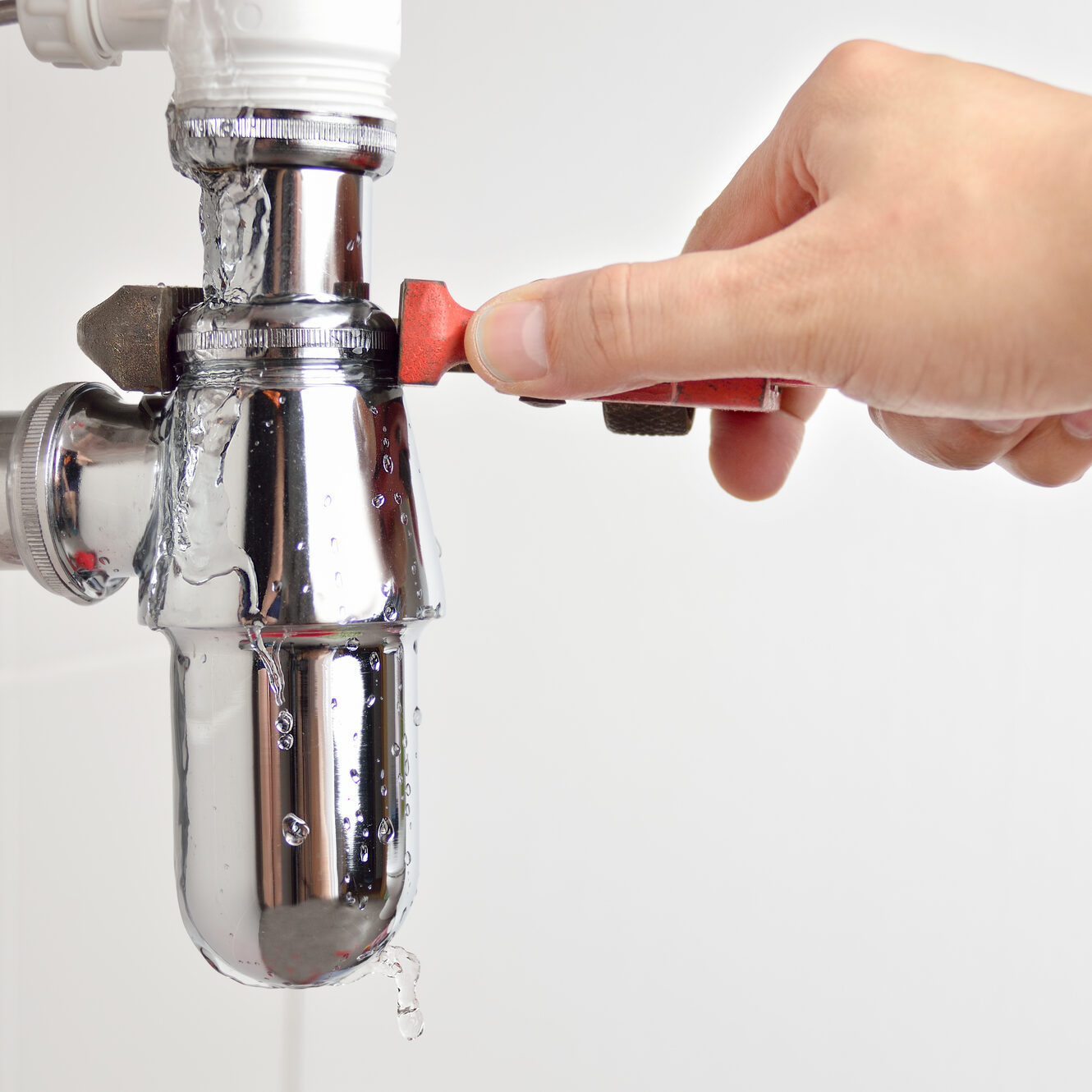 I have construction problems plumber fixing sink pipe with adjustable wrench